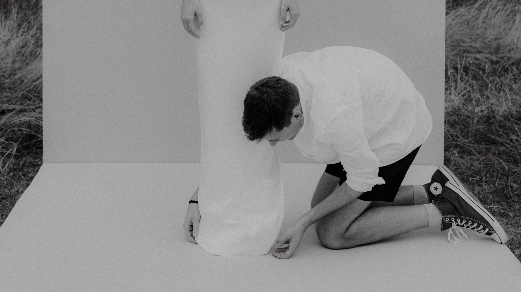 Raul Marinel Iacob pinning a hem in the studio
